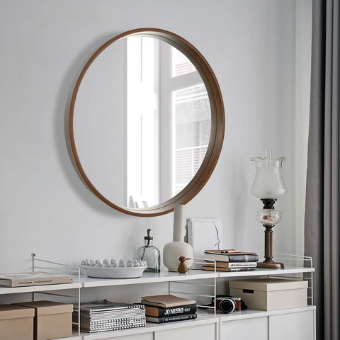 WallBeyond living room round mirror reflects light to enlarge small spaces.