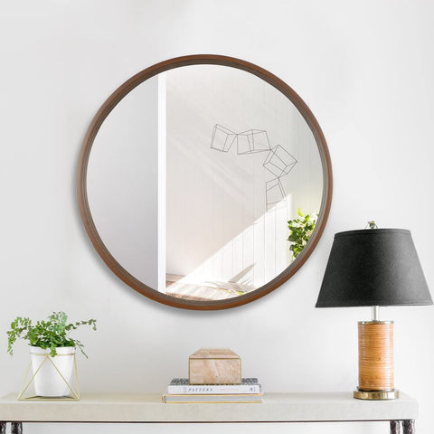 WallBeyond circle mirror walnut finish brightens spaces by reflecting light.