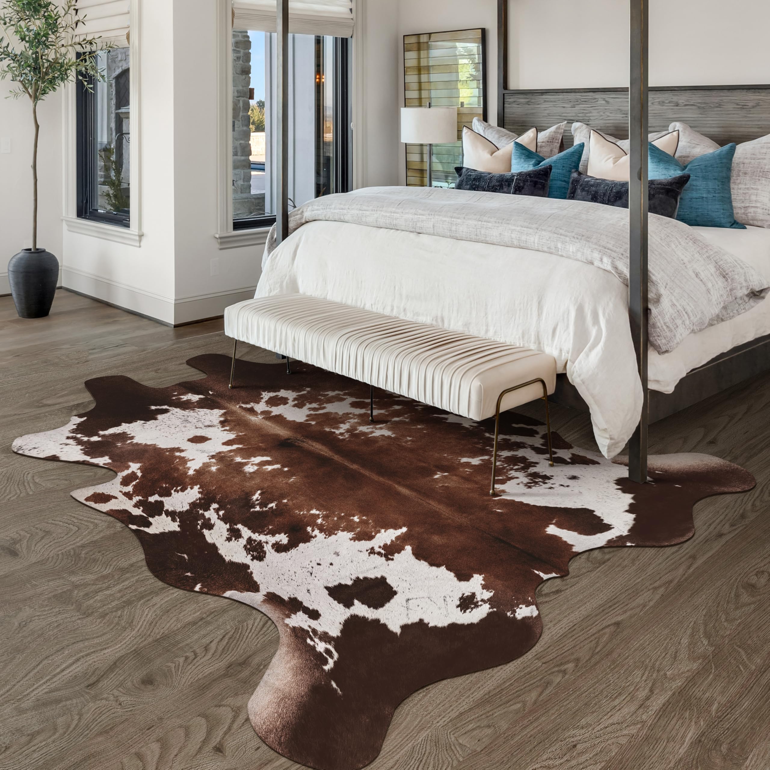 Warm Haven cowprint rug entryway elevates first impressions with pattern.