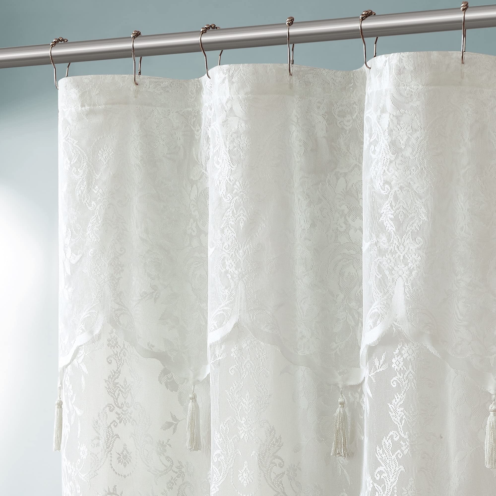 Warm Home Designs Ivory Lace Shower Curtain with seven tassels adds timeless texture.