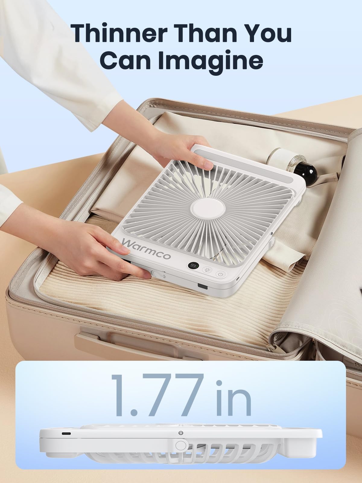 Warmco portable desk fan shown in a cozy bedroom setting.
