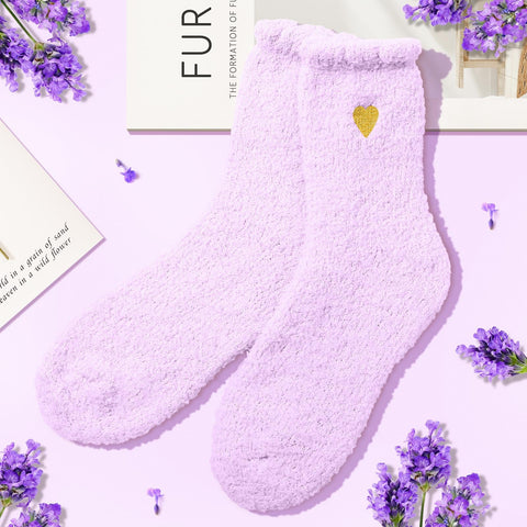 Wasocol diamond-shaped lavender soap rests on a bath shelf.