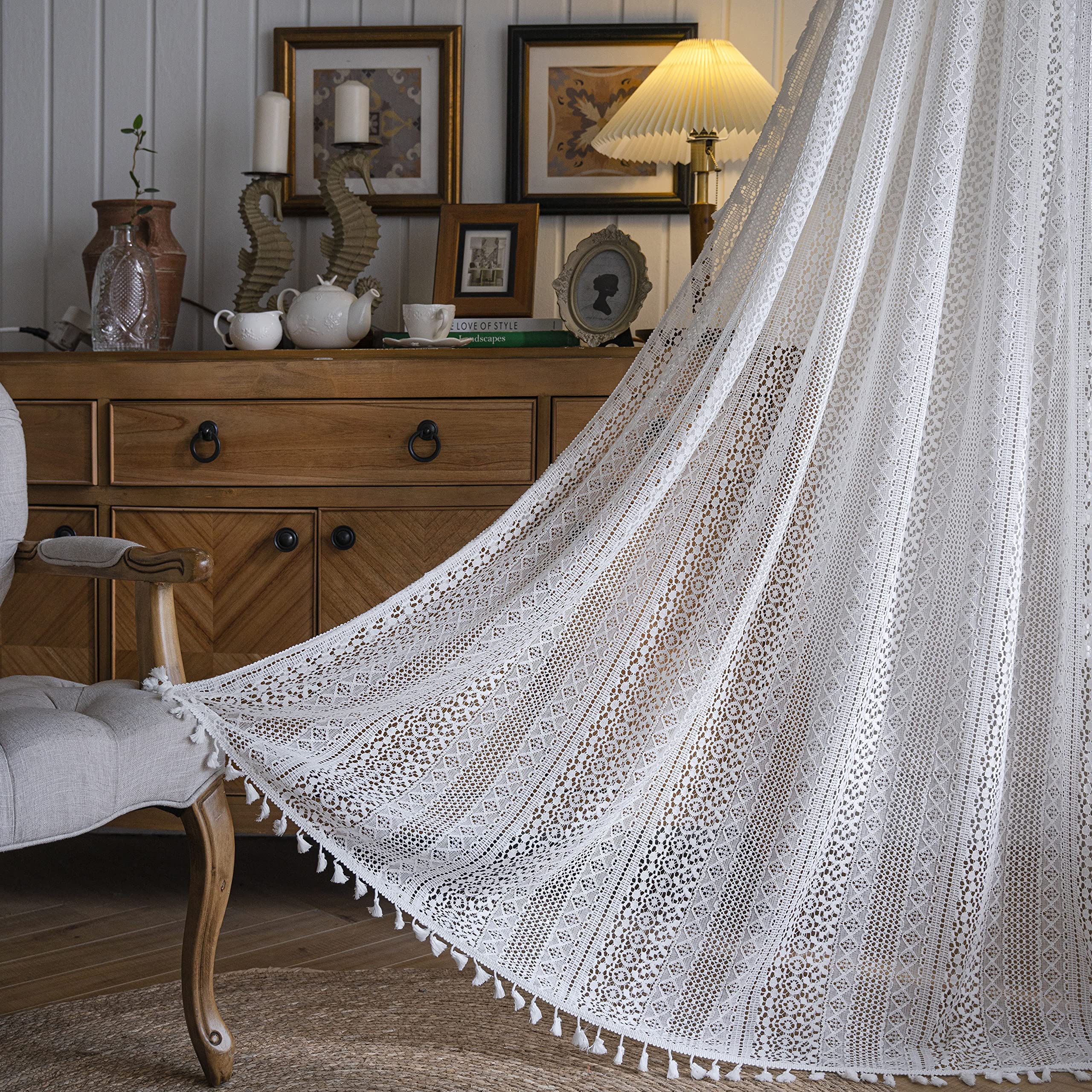 WAZZIO tassel accents on drapes enhance boho texture.
