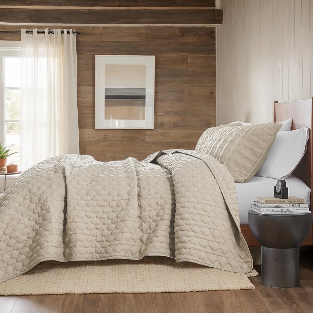 WDCOZY bed setup with beige quilt on a neutral bed.