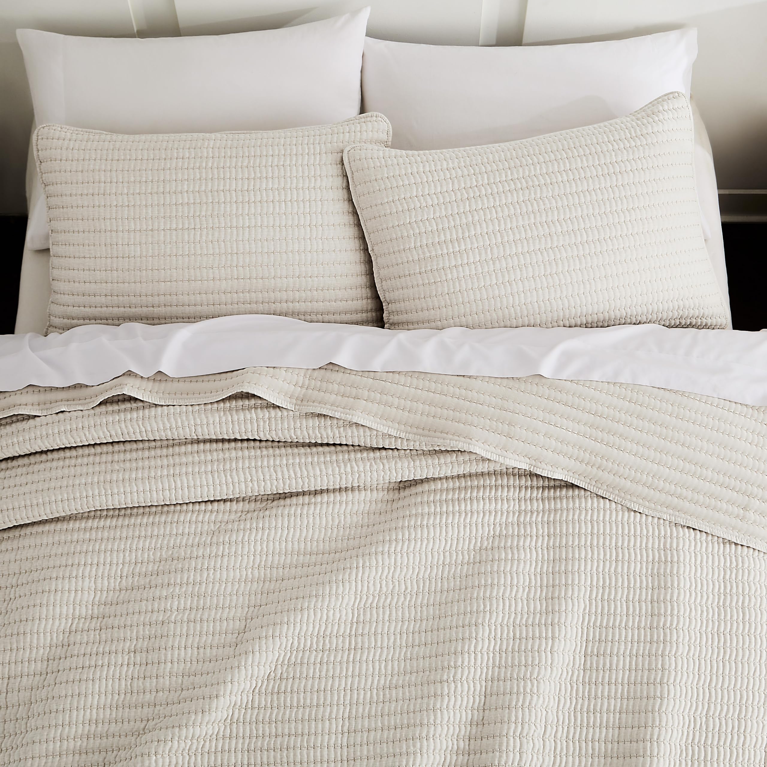 WDCOZY beige pick stitch quilt set on a queen bed for elegant coziness