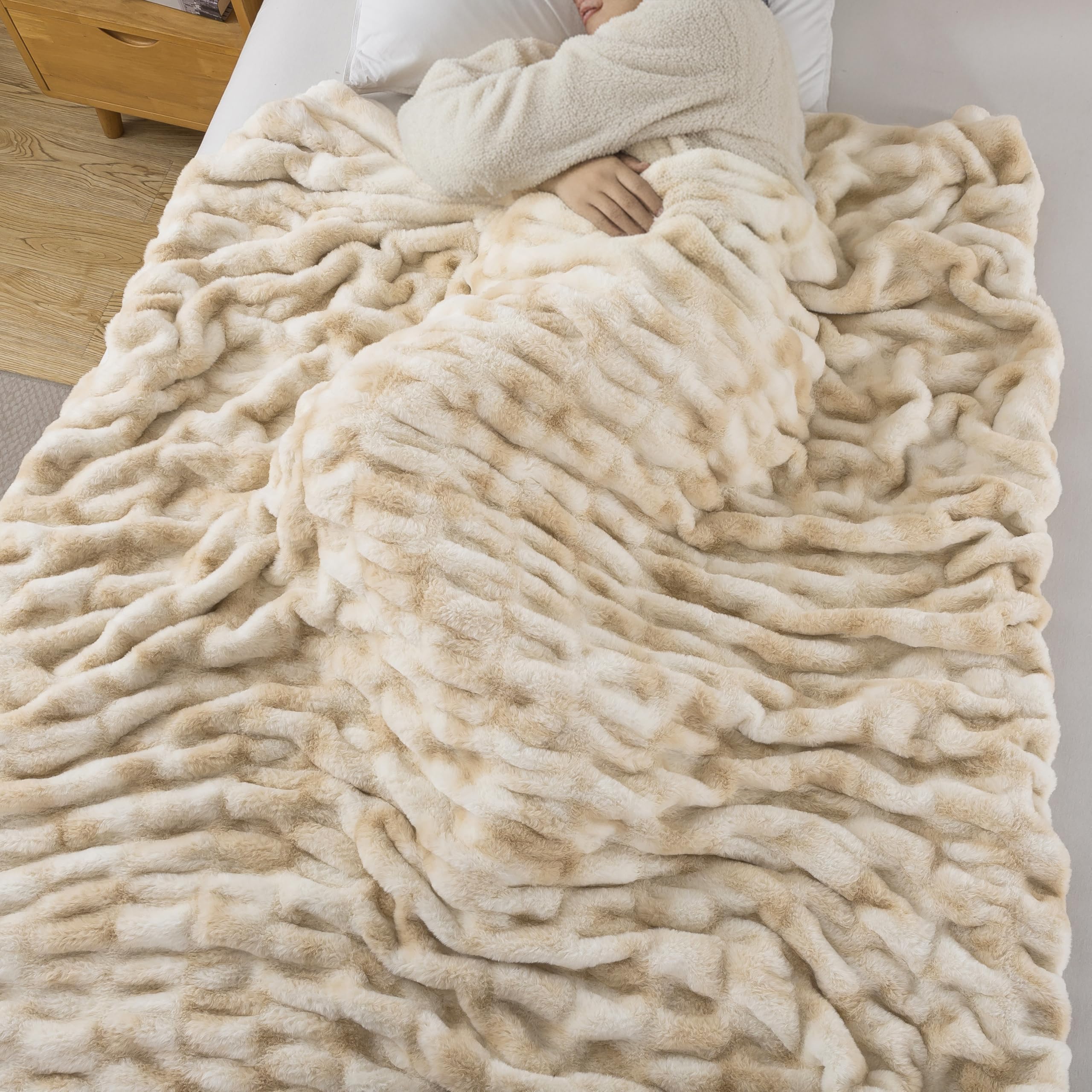 WDCOZY ruched blanket draped on sofa adds elegant texture to living room.