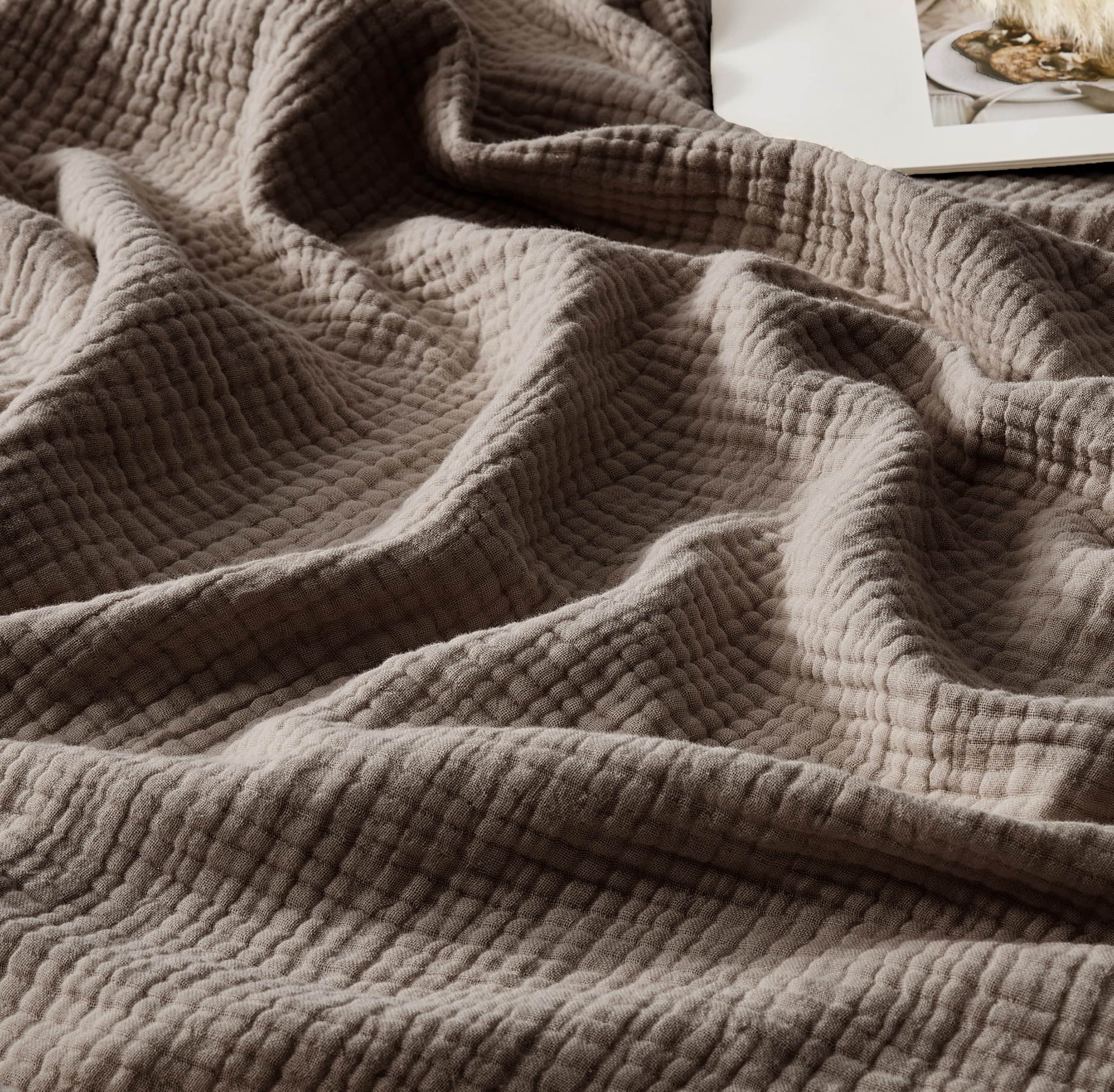 WDCOZY queen-size muslin blanket on bed for soft, breathable warmth.