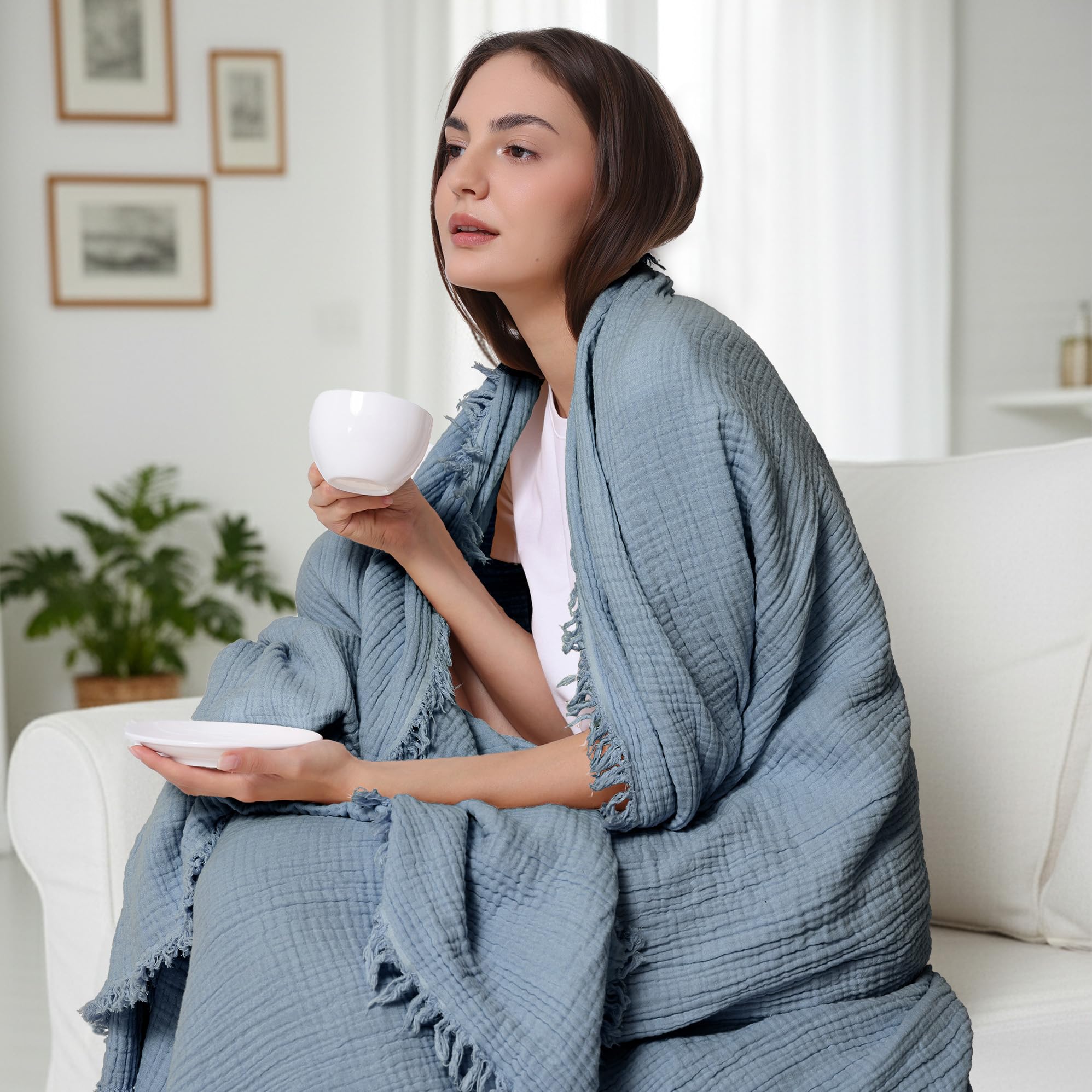 WDCOZY Muslin Blanket on sofa demonstrates twin-size 60x80 fit for bedrooms.