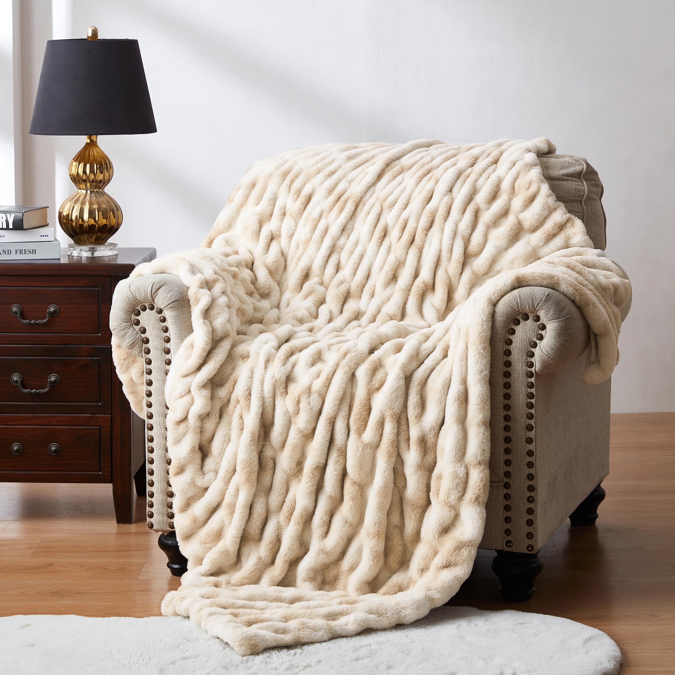 WDCOZY ruched faux fur throw blanket on sofa for luxurious warmth.