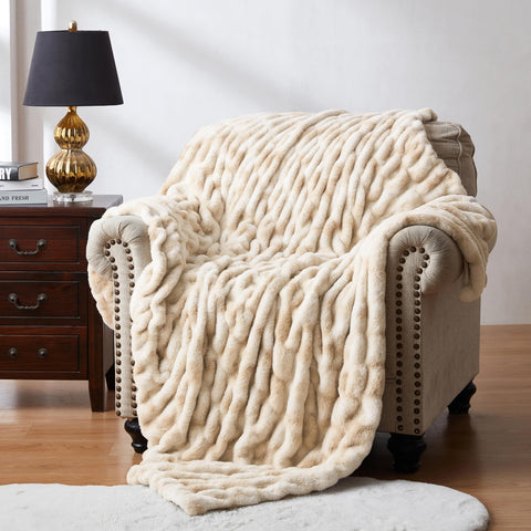 WDCOZY ruched faux fur throw blanket on sofa for luxurious warmth.
