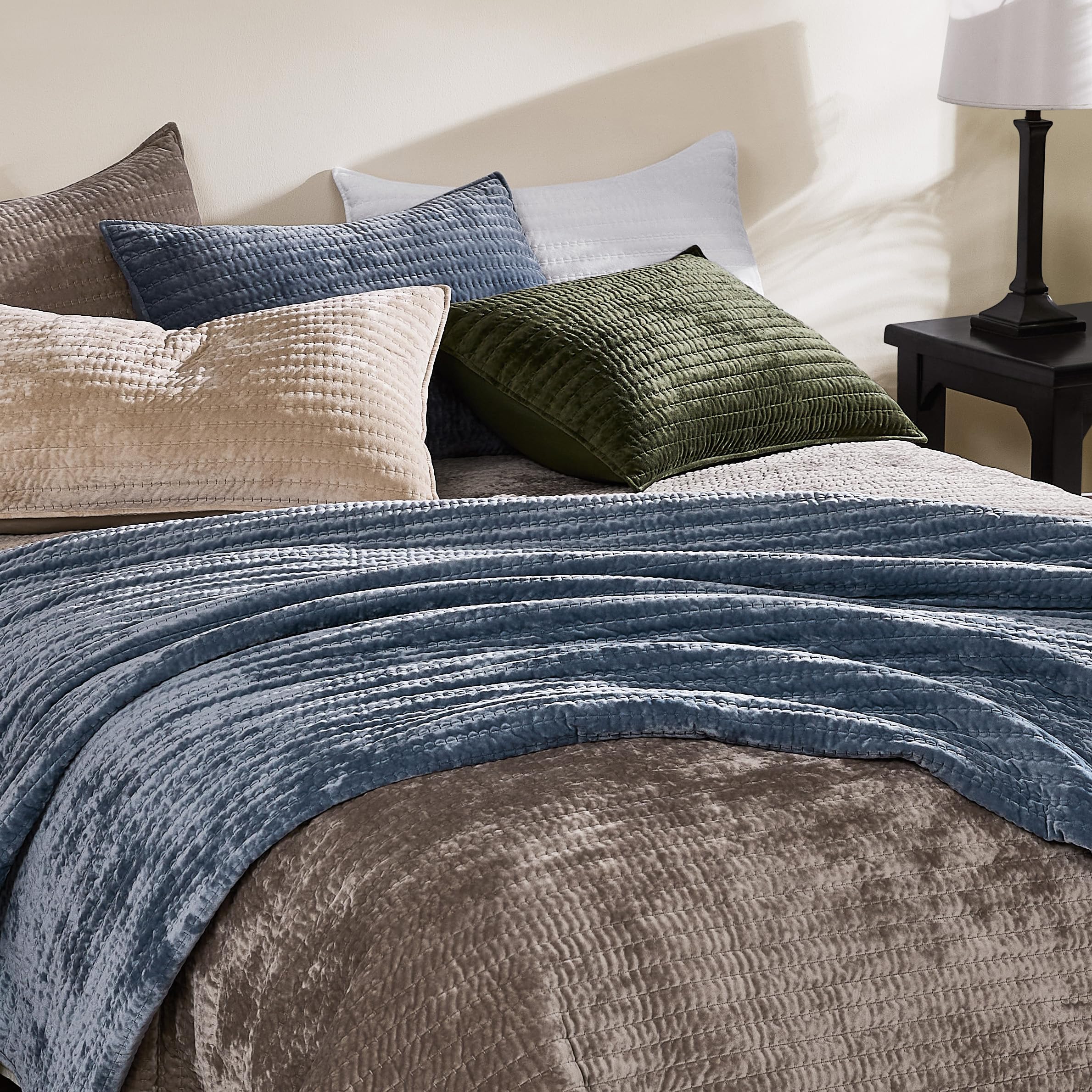 WDCOZY velvet California quilt displayed in a cozy, stylish bedroom setting