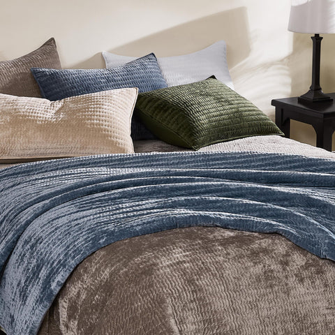 WDCOZY velvet California quilt displayed in a cozy, stylish bedroom setting