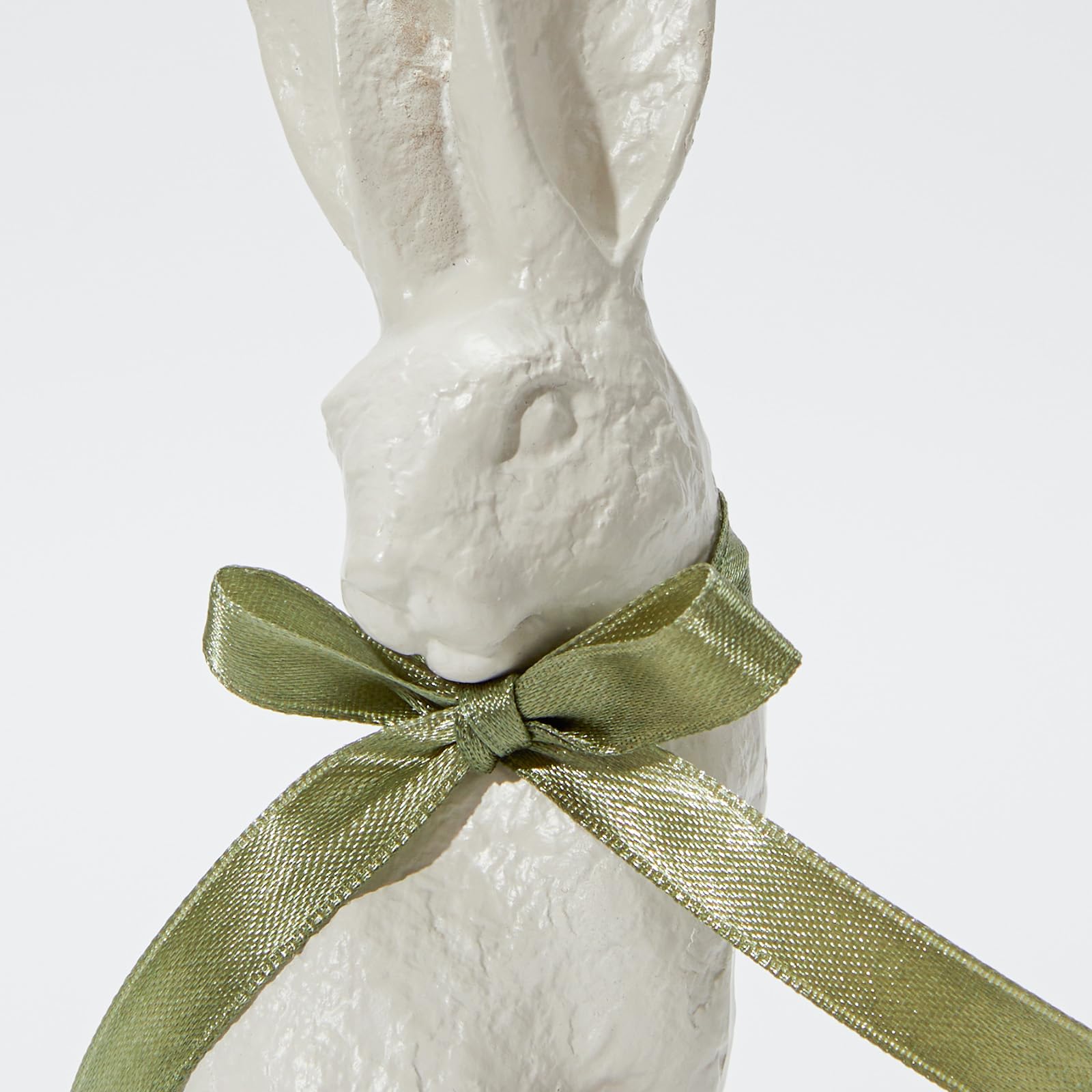 Elegant resin bunnies complement weddings or spring gatherings with calm, modern flair.