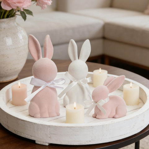 WDS WONDROUS pink and white resin bunnies with flocked finish add tactile charm.