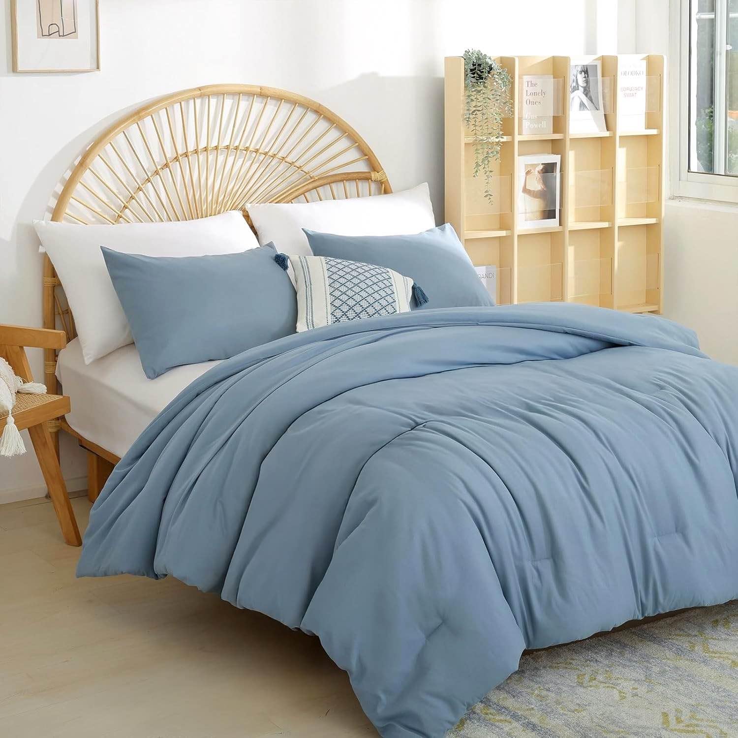 Weigelia boho twin comforter in dusty blue on bed for versatile styling and comfort
