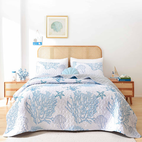 Weigelia Coastal Quilts Queen blue quilt flatlay shows breezy seaside style.