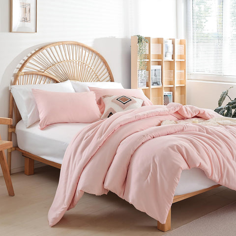 Queen bed styled with Weigelia blush pink comforter