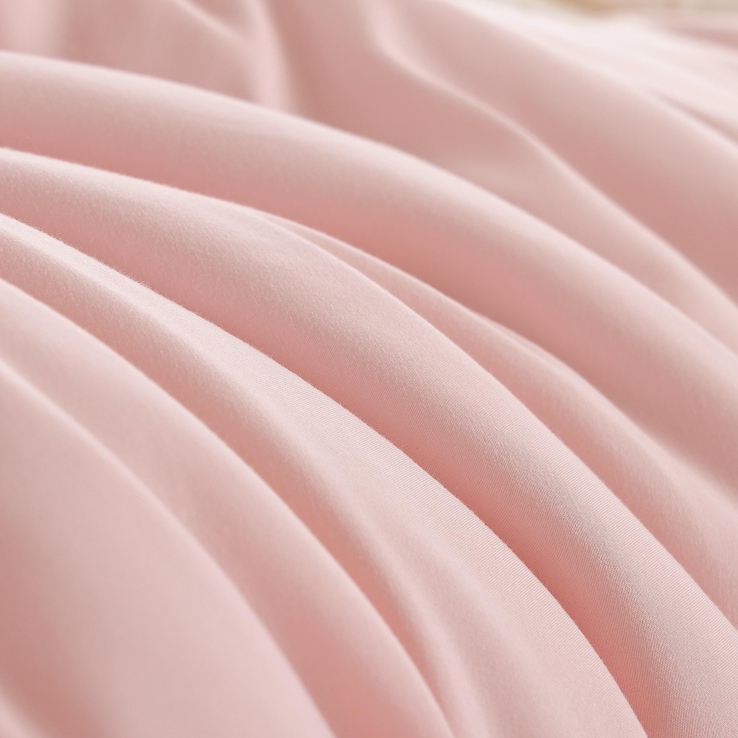 Weigelia twin-size pink comforter with pillowcase complements neutral bedding.