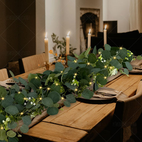WEITANKG eucalyptus garland framing a wedding arch with LEDs