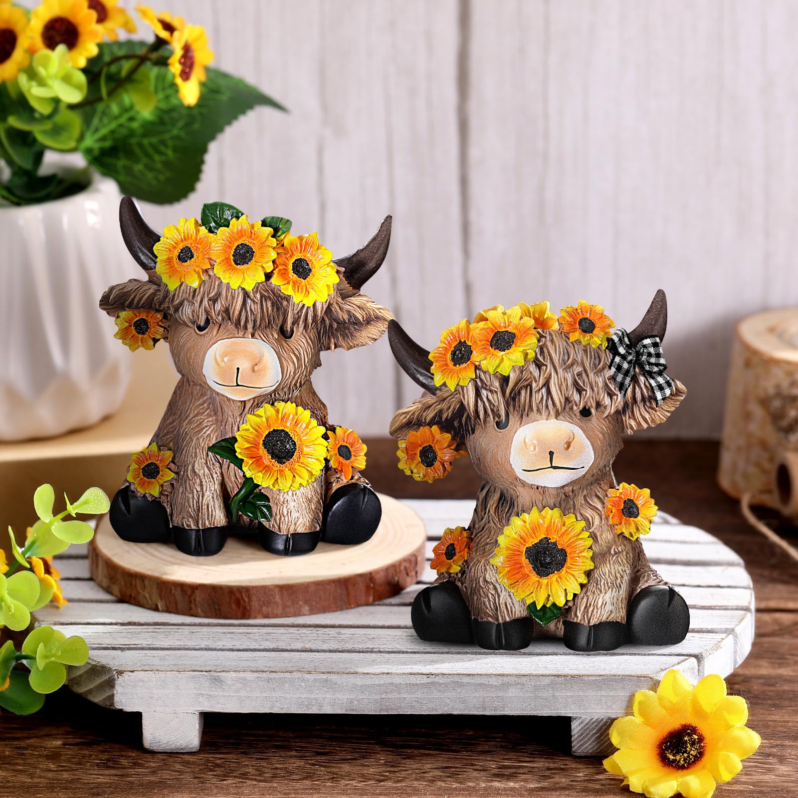 Wesiti Highland cow statue on mantel creates welcoming vibe.