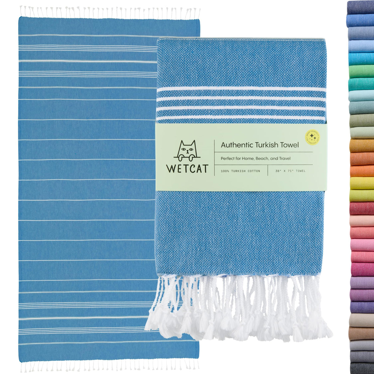 WETCAT Turkish beach towel oversized blue spread on sand, ideal for absorbency and coverage.
