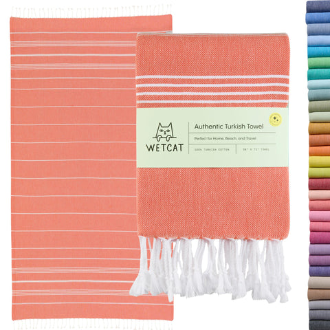 WETCAT Turkish Beach Towel Oversized 38x71 spread on sunlit sand, ideal for beach days.