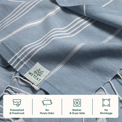 Wetcat Turkish towel in denim blue—sand-free and dries fast.