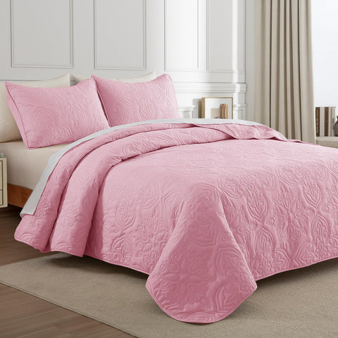 Whale Flotilla pink damask bedspread highlighting vintage style.