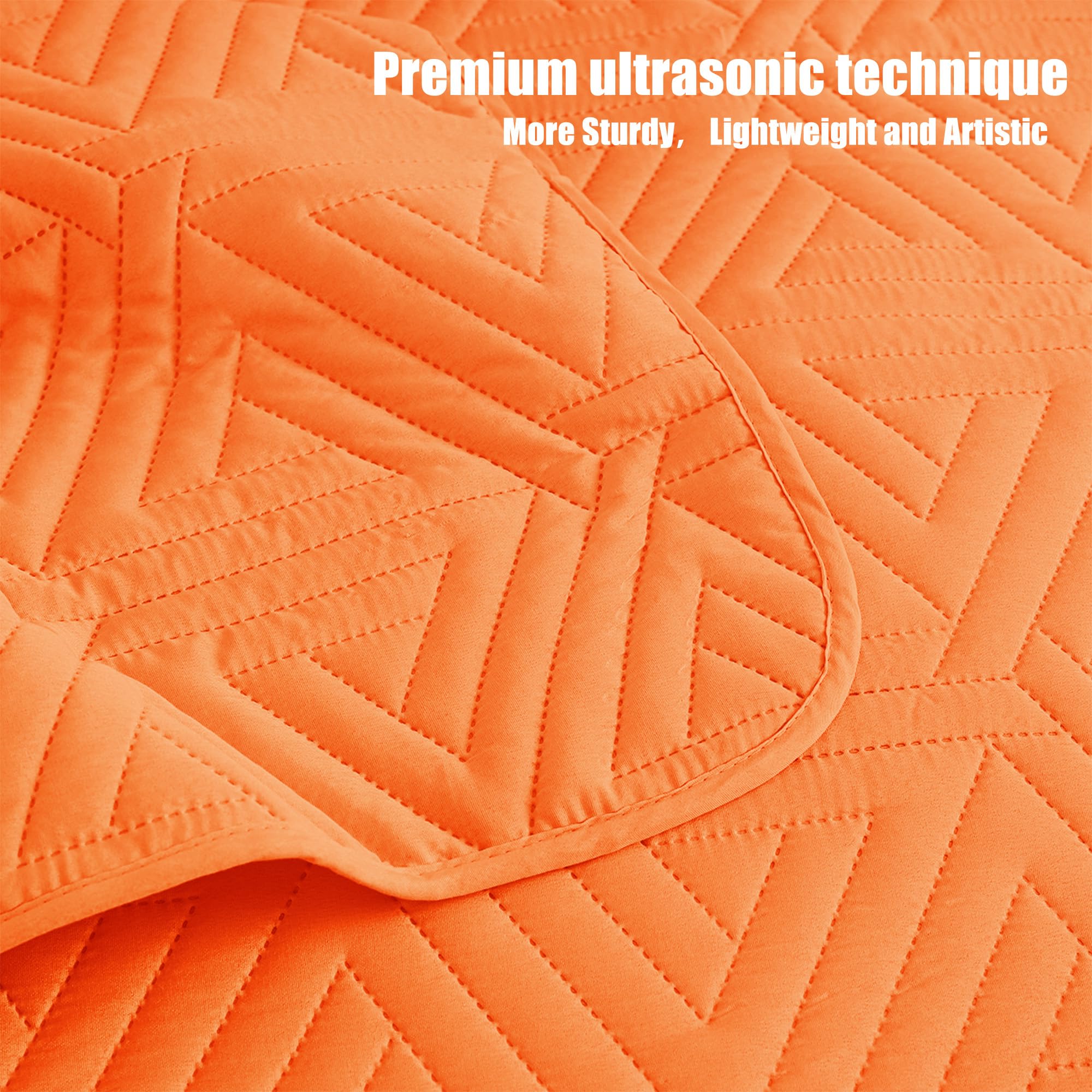 Whale Flotilla easy-care quilt orange stays vibrant after cold-wash cycles.