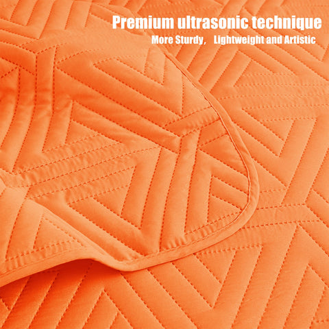 Whale Flotilla easy-care quilt orange stays vibrant after cold-wash cycles.