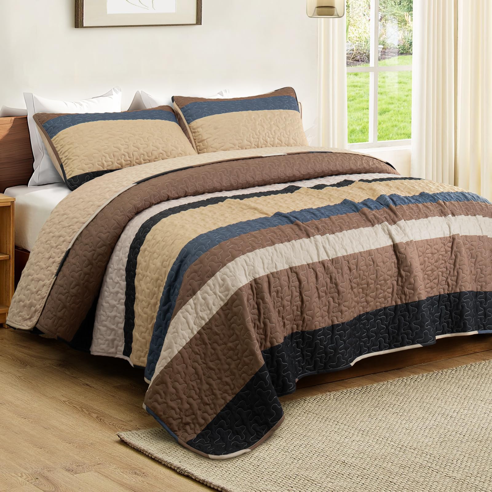 Whale Flotilla king quilt shown on bed or sofa for cozy versatility