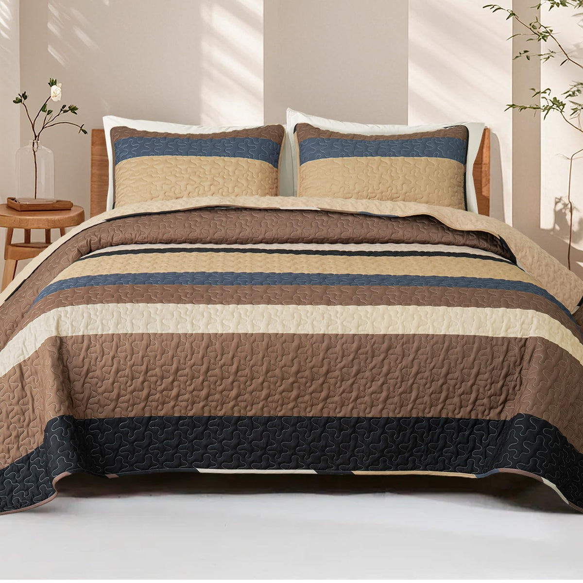 Whale Flotilla reversible camel quilt on bed showcasing versatile all-season design