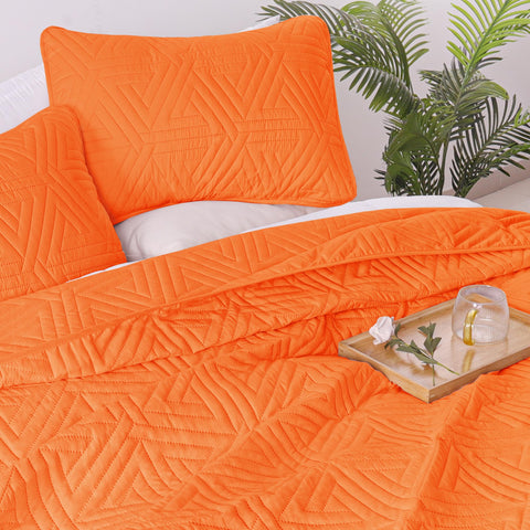 Whale Flotilla reversible quilt orange delivers two looks in one cozy set.