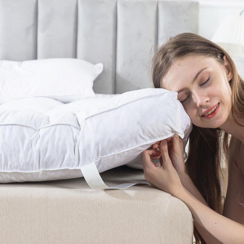 WhatsBedding 5 Inch Feather Topper on bed with cloud-like support.