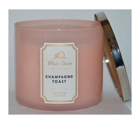 White Barn Champagne Toast 3-wick candle glows warmly, creating a festive mood