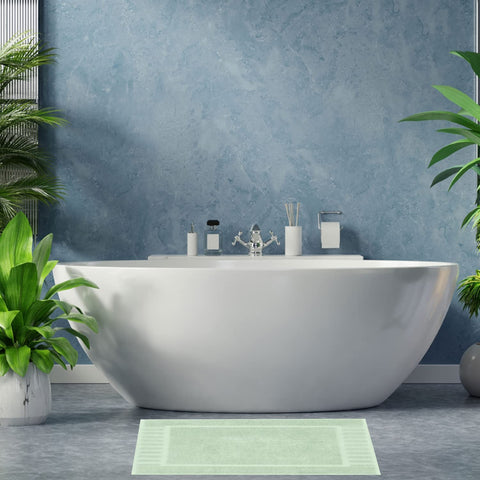 White Classic bath mat folded over tub in green showing generous size.