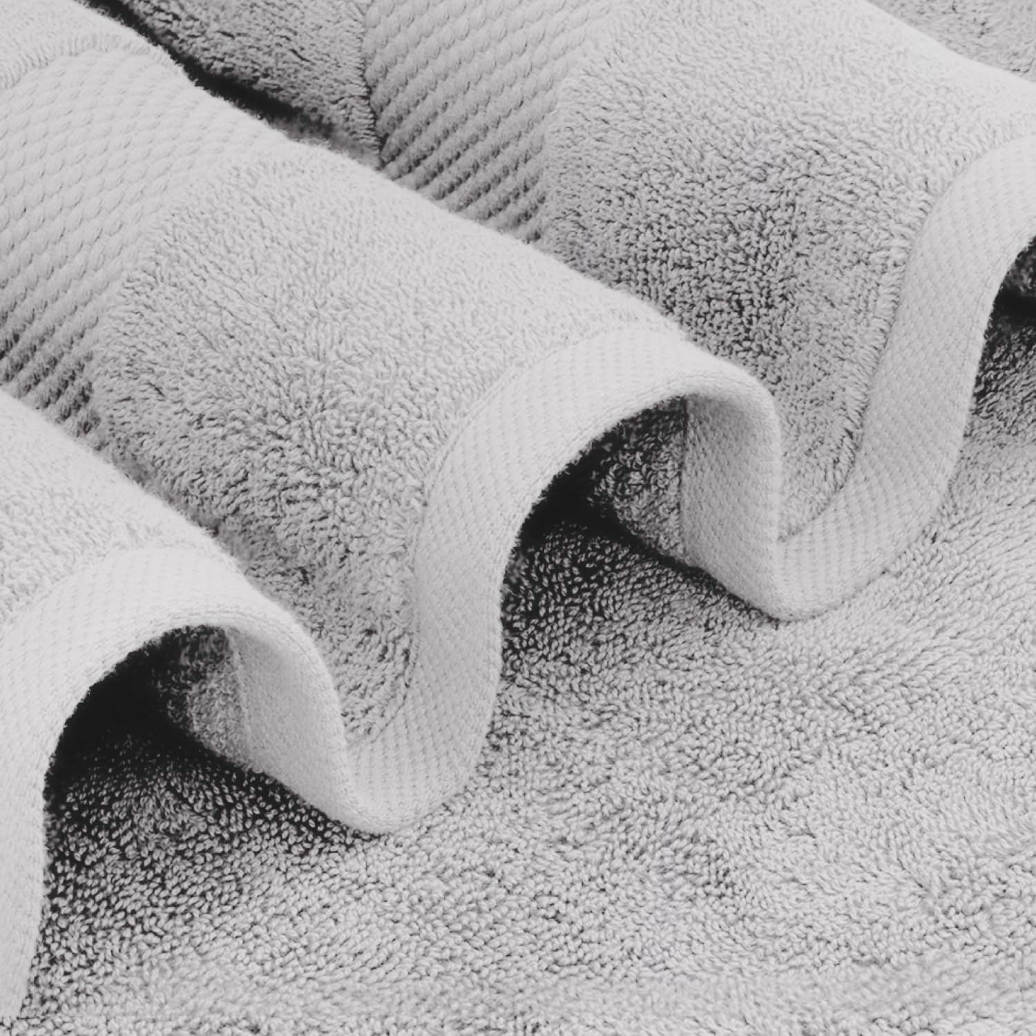 White Classic Dolphin Gray towels folded, ready for spa-like at-home pampering.