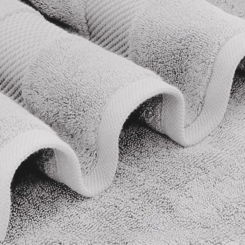 White Classic Dolphin Gray towels folded, ready for spa-like at-home pampering.