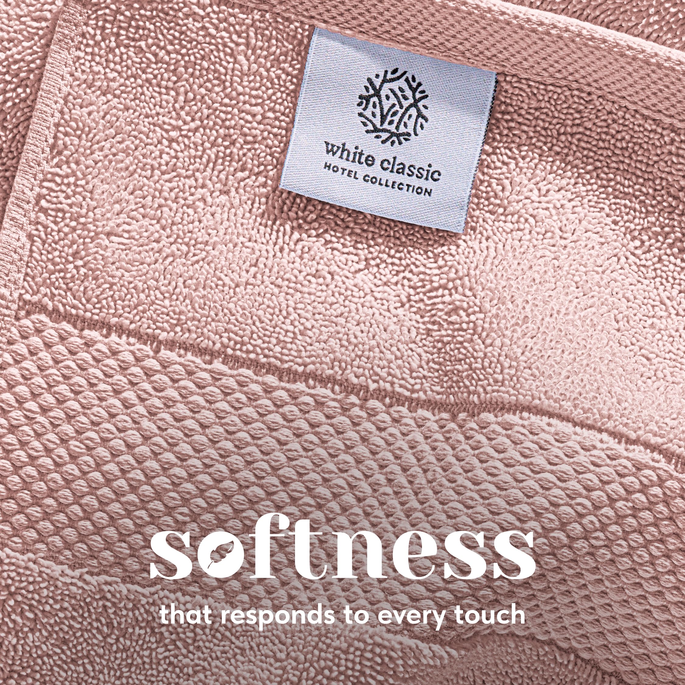 White Classic hand towels folded in pink, emphasizing soft weave
