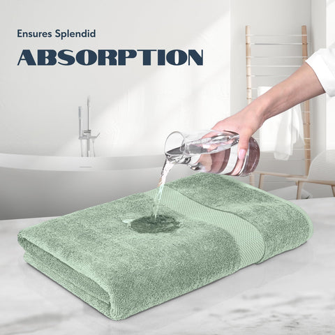 White Classic towels draped in a spa-inspired bathroom setup.