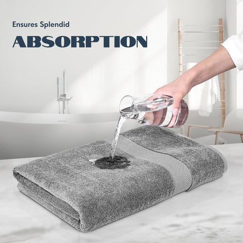 Hotel-style White Classic towels neatly stacked in a bathroom