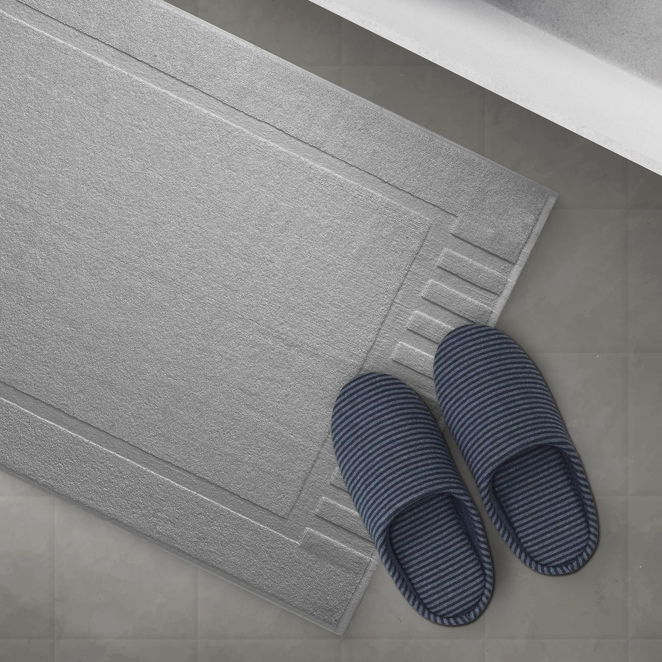 White Classic mat shown by tub or sink demonstrating generous 22x34 inch coverage