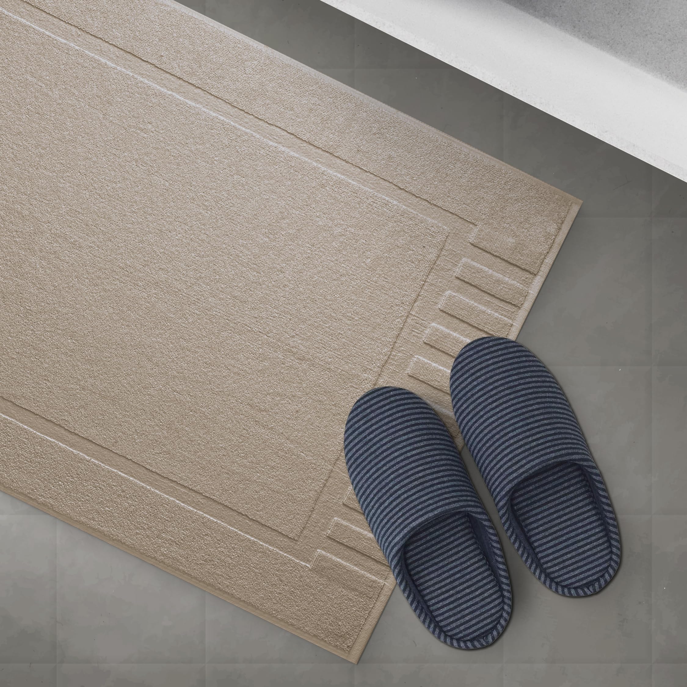 White Classic taupe bath mat beside sink for daily comfort.
