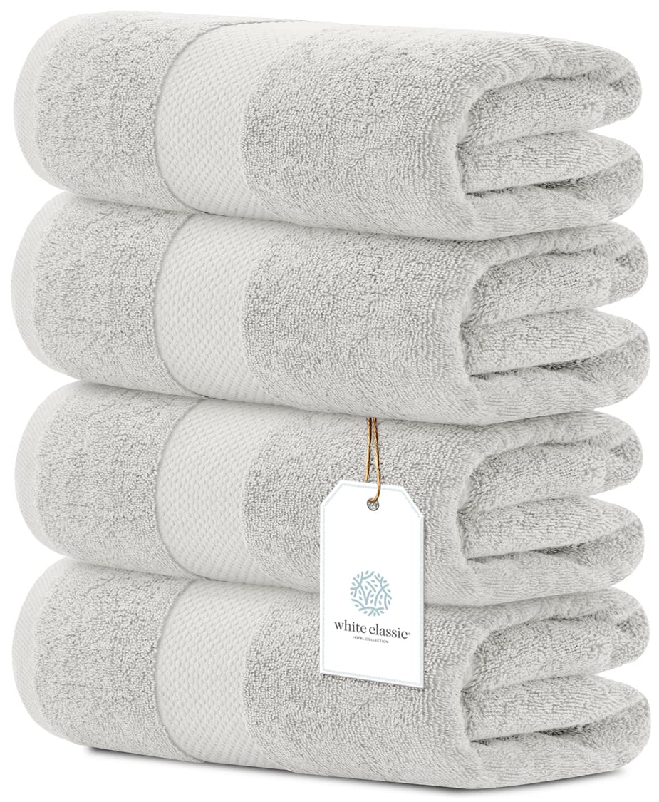 White Classic luxury bath towels set, four-piece wide-shot, showcasing plush hotel-grade softness.