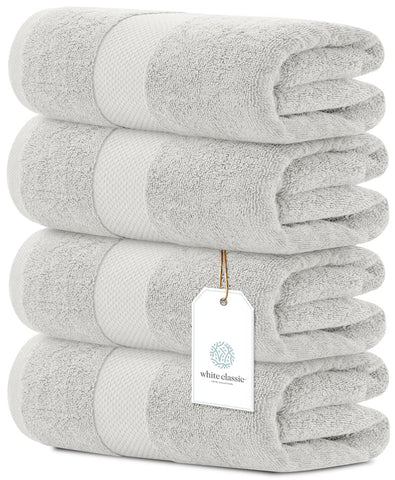 White Classic luxury bath towels set, four-piece wide-shot, showcasing plush hotel-grade softness.
