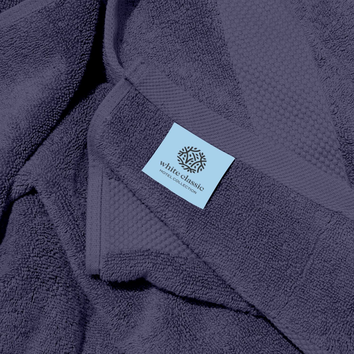 White Classic towel demonstrating quick-drying and high absorbency.