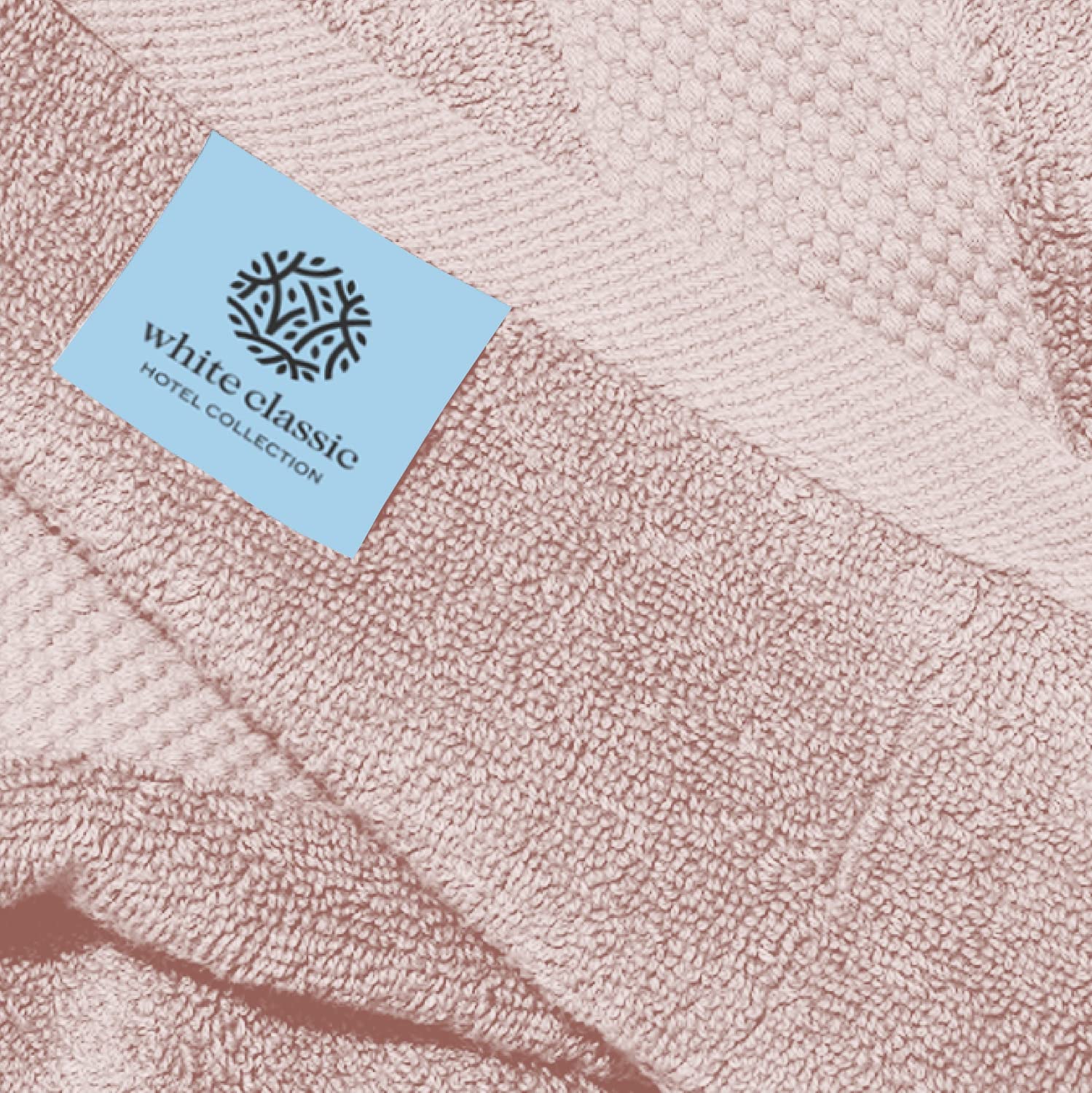 White Classic hotel collection towels in a bright bathroom scene.