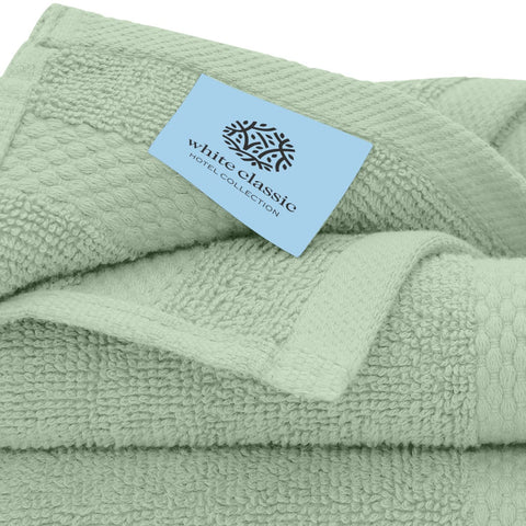 White Classic washcloth with reinforced double-needle edge stitching.
