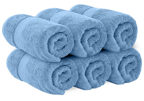 White Classic folded towels on a rack show premium softness and organization.