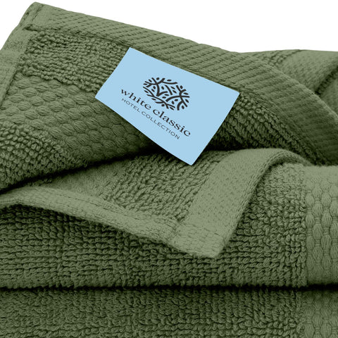 White Classic forest green washcloth on shelf in a bathroom setting